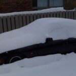 snow covered porsche 944